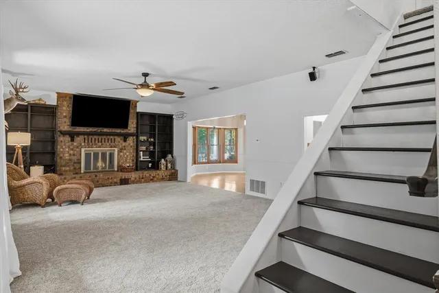 a view of a livingroom with furniture and a flat screen tv