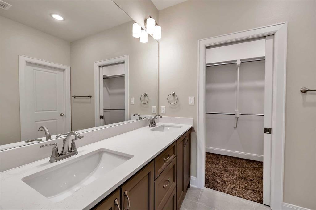 4344 Macnab Drive, Unit MULTI Tyler, TX 75707 - Photo 16 of 24 a bathroom with a sink double vanity and a mirror
