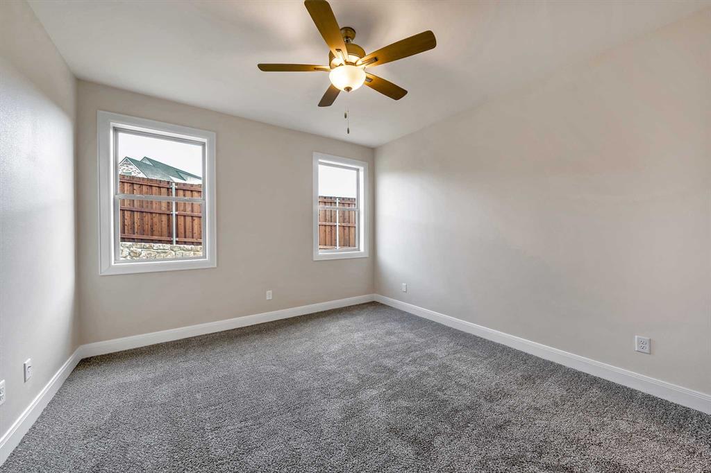 4344 Macnab Drive, Unit MULTI Tyler, TX 75707 - Photo 20 of 24 an empty room with a window and a fan