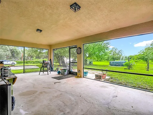 a view of a park with large trees