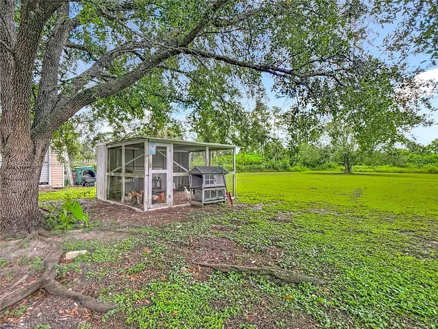 a view of a house with a big yard