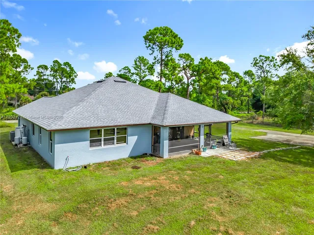 a view of a house with a big yard