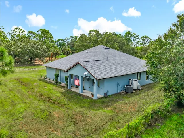 a house view with a garden space