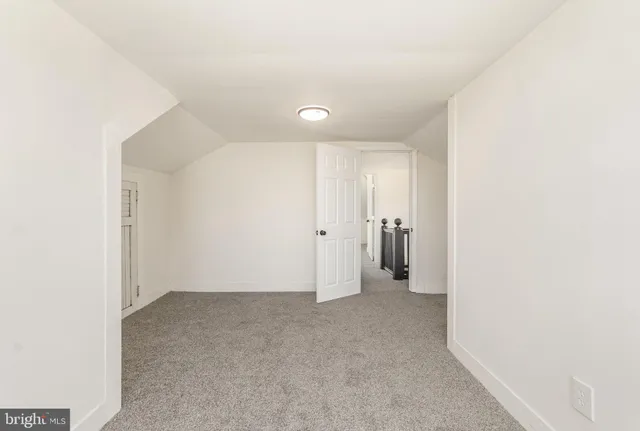 a view of hallway with white wall