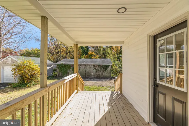 a view of a balcony with wooden floor