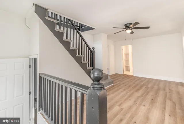 a view of a hallway with a front door