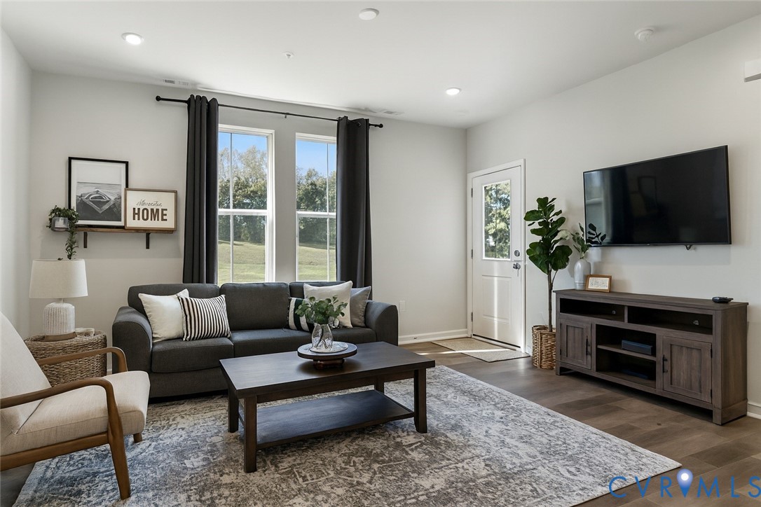 a living room with furniture and a flat screen tv