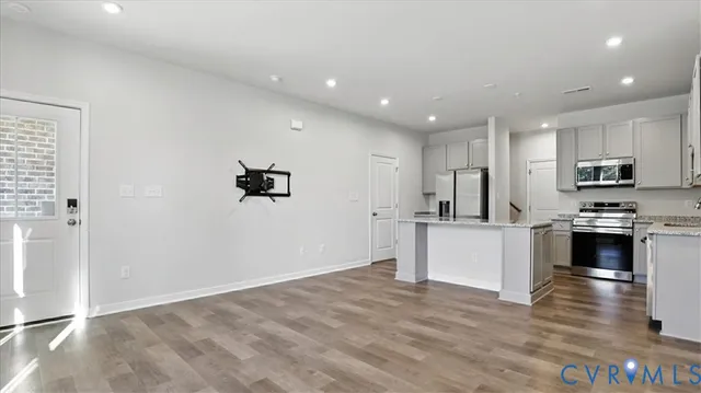 a view of kitchen with microwave and cabinets