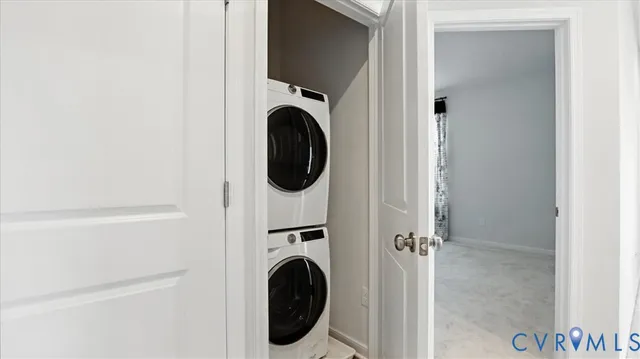 a view of a hallway with washer and dryer