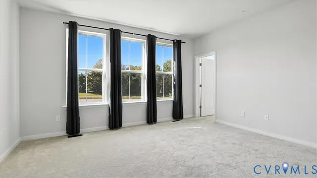 a view of an empty room and window