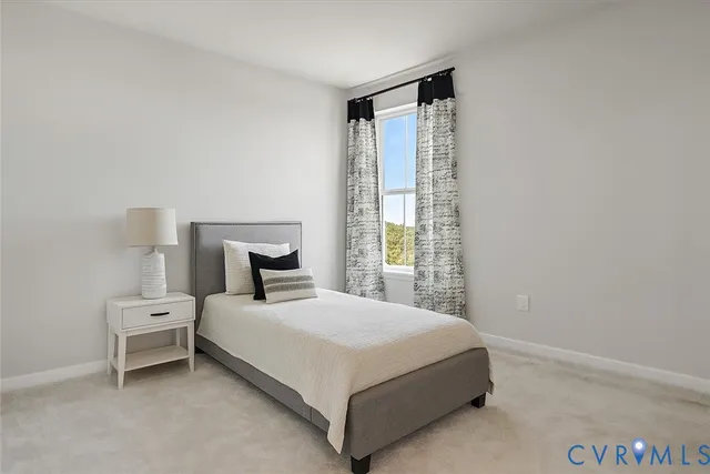 an empty room with closet and windows