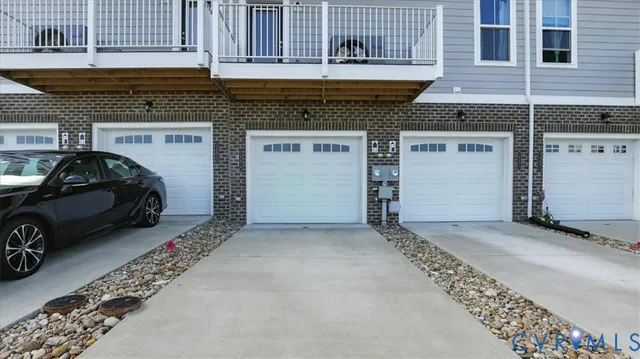 a view of a street with a garden