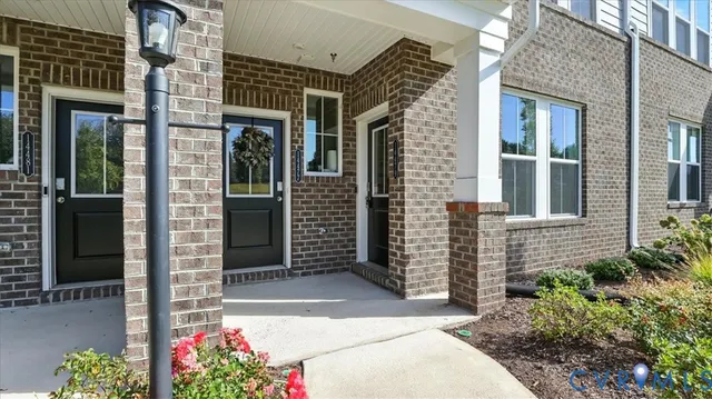 front view of a brick house with a entryway