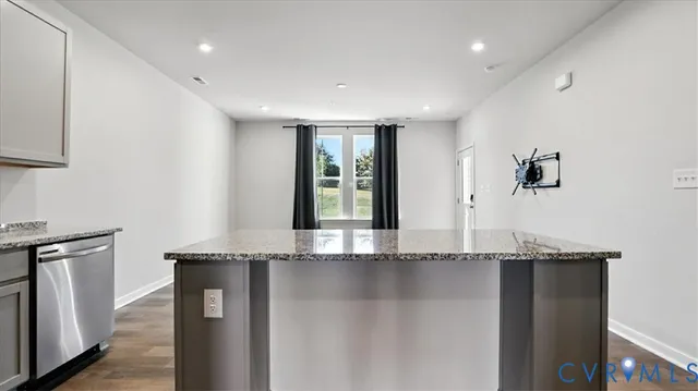 a view of a kitchen with granite countertop a sink and dishwasher
