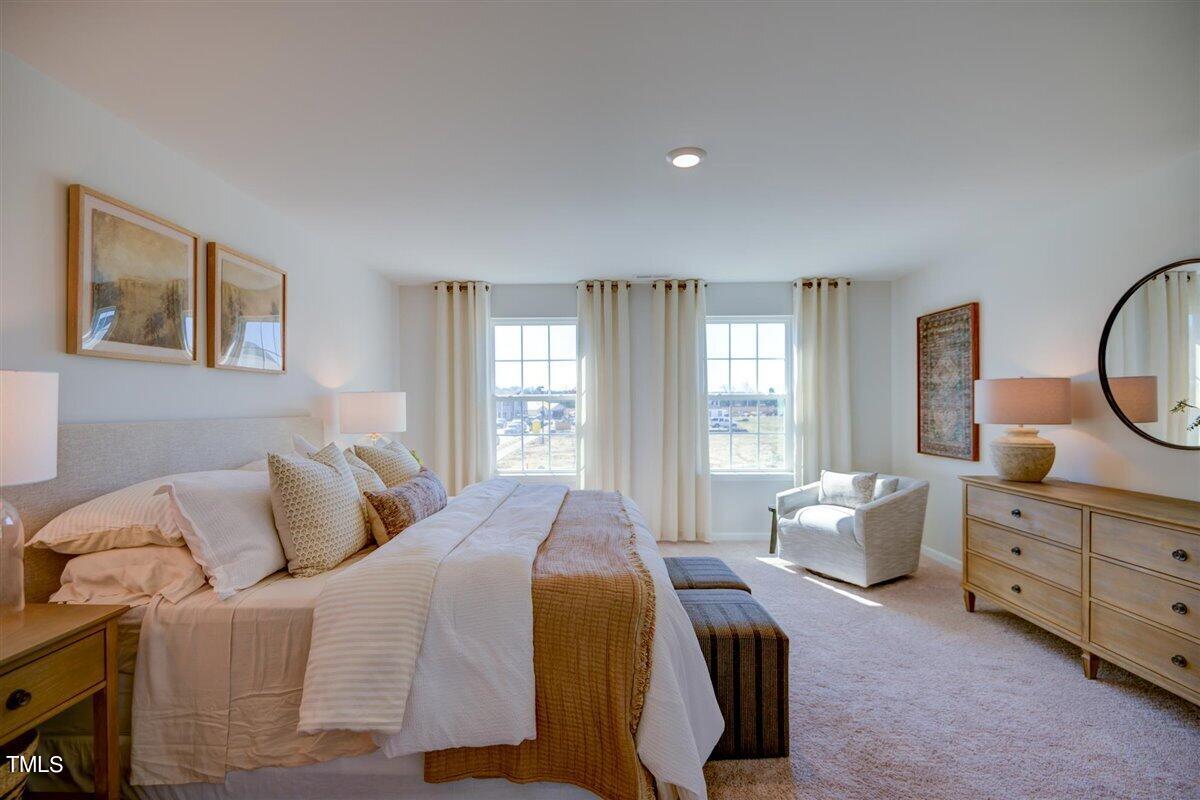 3609 Drafton Drive Raleigh, NC 27610 - Photo 26 of 40 a bedroom with a bed and a window