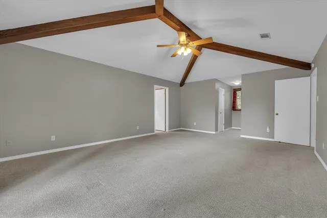 a large spacious bathroom with a large tub and shower