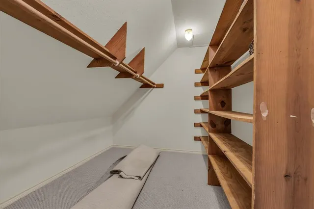 a view of a room with racks on the wall