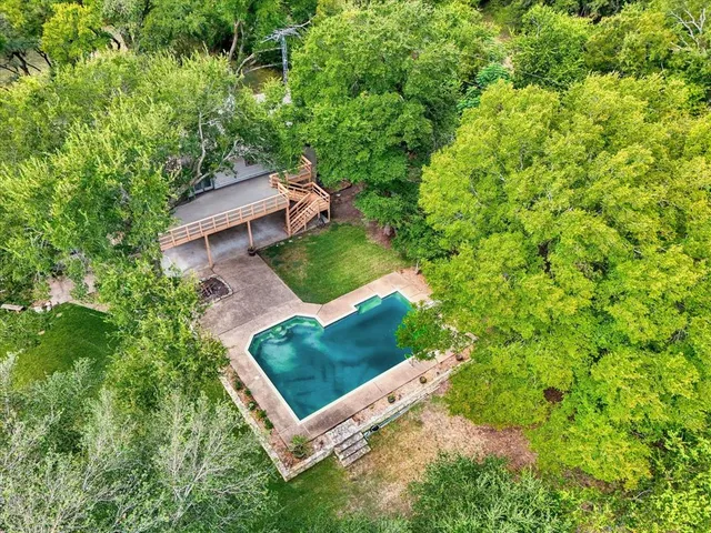 a view of a house with swimming pool
