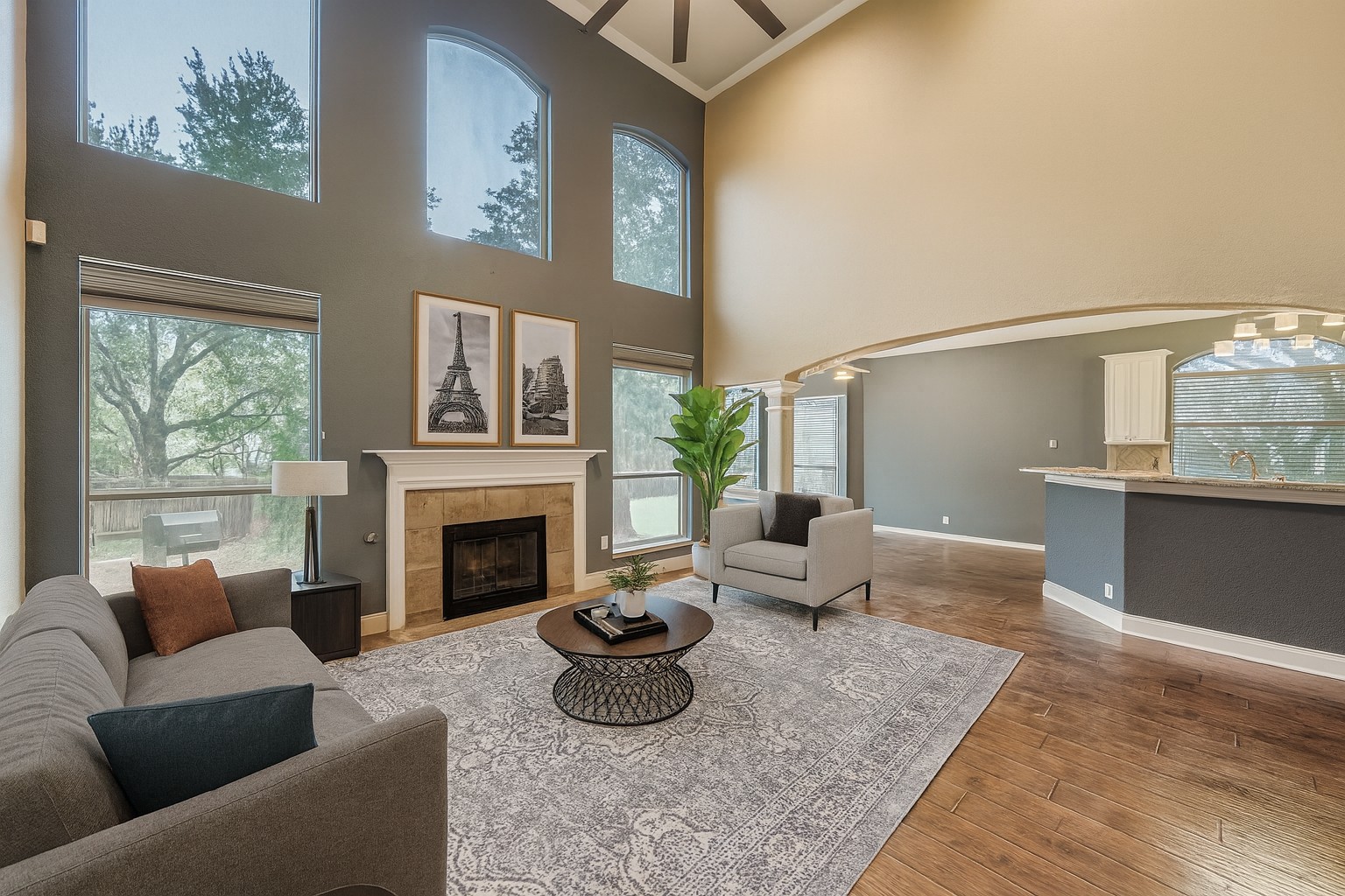 a living room with furniture and a fireplace