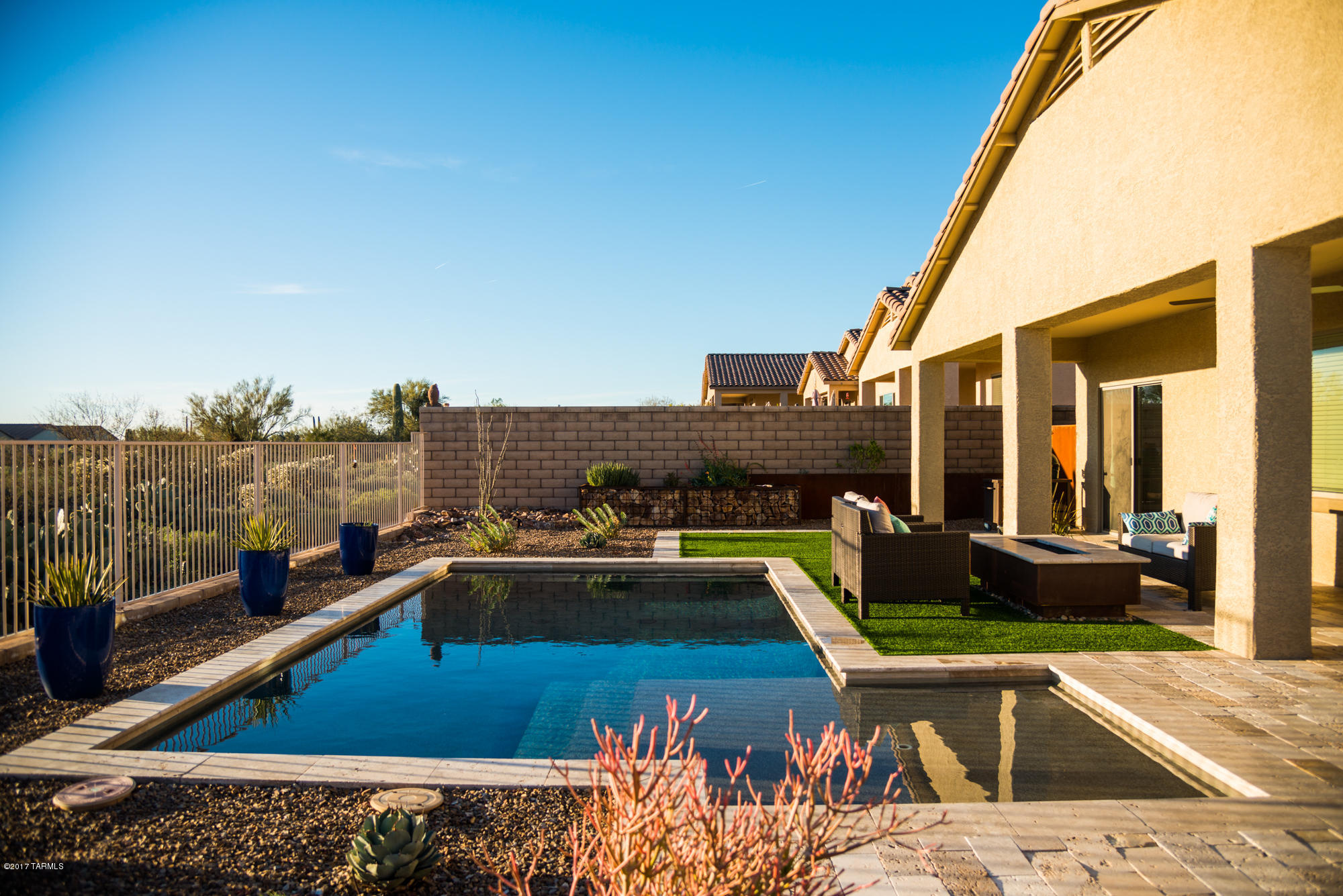 4405 West Crystal Ranch Place Marana, AZ 85658 - Photo 21 of 44 a view of a swimming pool with a lounge chair