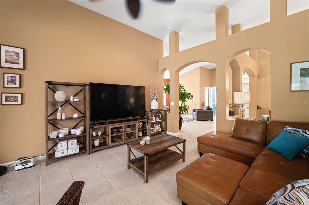 9020 North River Road Tampa, FL 33635 - Photo 12 of 86 a living room with furniture and a flat screen tv
