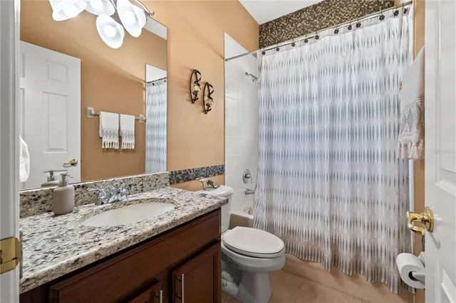 a view of a lake with a house in the background