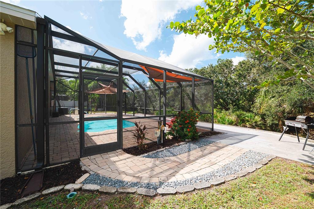 9020 North River Road Tampa, FL 33635 - Photo 49 of 86 a view of a backyard with sitting area and furniture