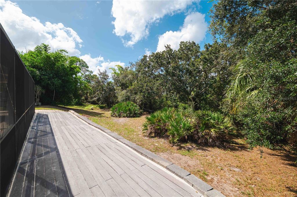 9020 North River Road Tampa, FL 33635 - Photo 50 of 86 a view of balcony with wooden floor
