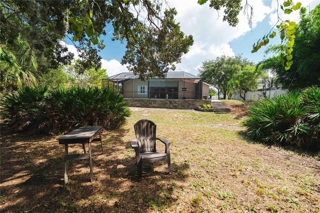 9020 North River Road Tampa, FL 33635 - Photo 56 of 86 a view of a backyard with sitting area