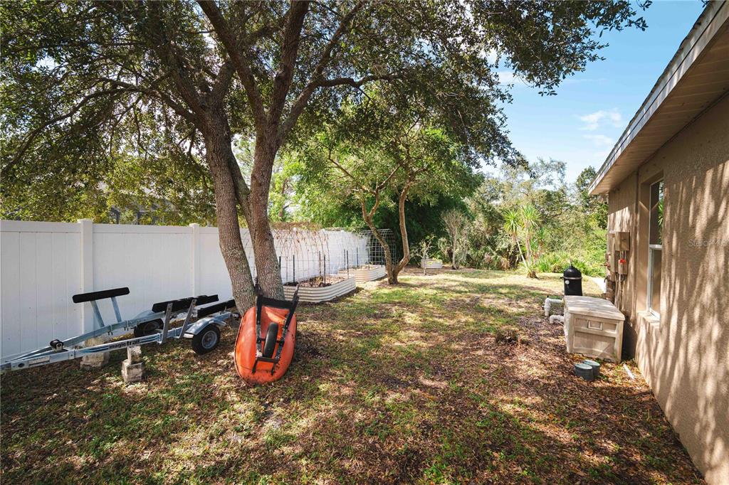 9020 North River Road Tampa, FL 33635 - Photo 67 of 86 a backyard of a house with table and chairs