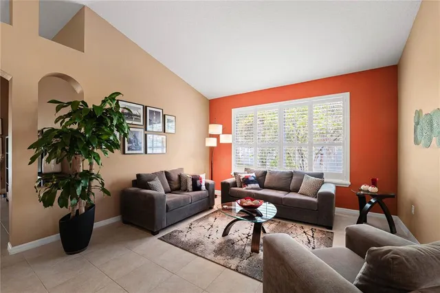 a dining room with furniture and window