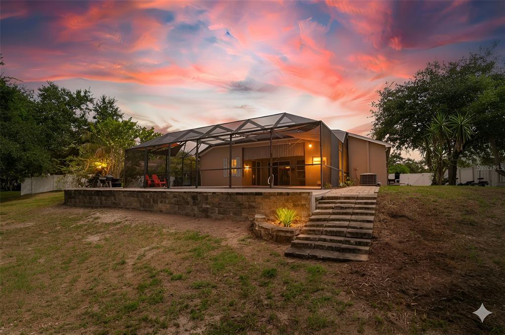 9020 North River Road Tampa, FL 33635 - Photo 79 of 86 a front view of a house with a yard