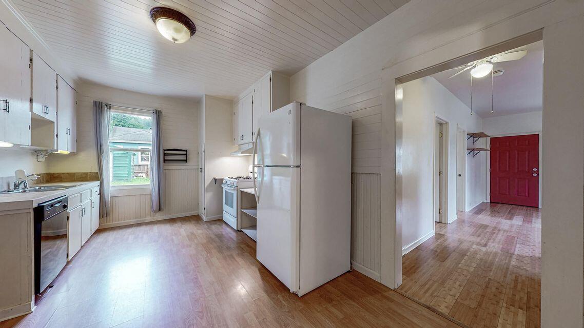 111 Monument Road Rio Dell, CA 95562 - Photo 15 of 26 a kitchen with a refrigerator and a stove top oven
