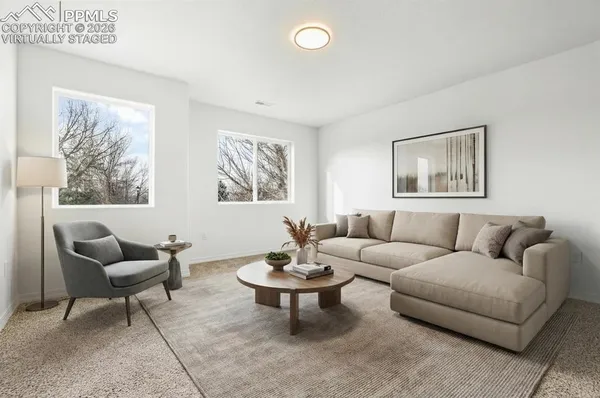 a bedroom with a bed and a couch