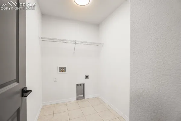 an empty room with closet area