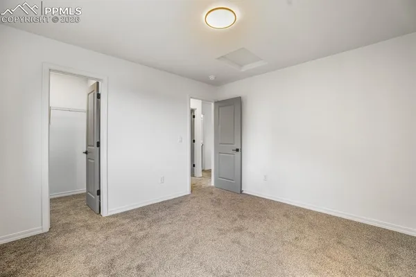 a bedroom with bed and a window