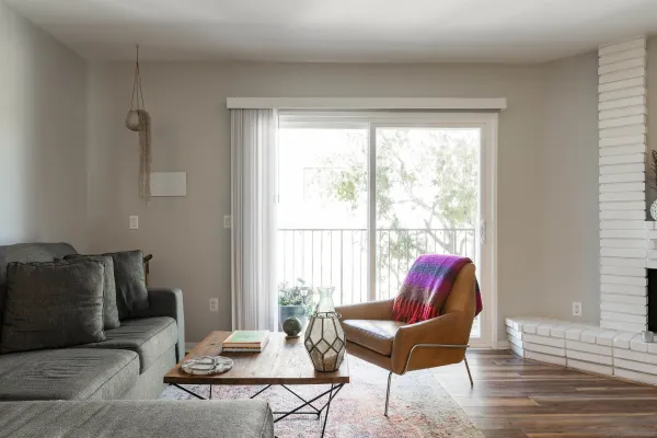 a living room with furniture and a window