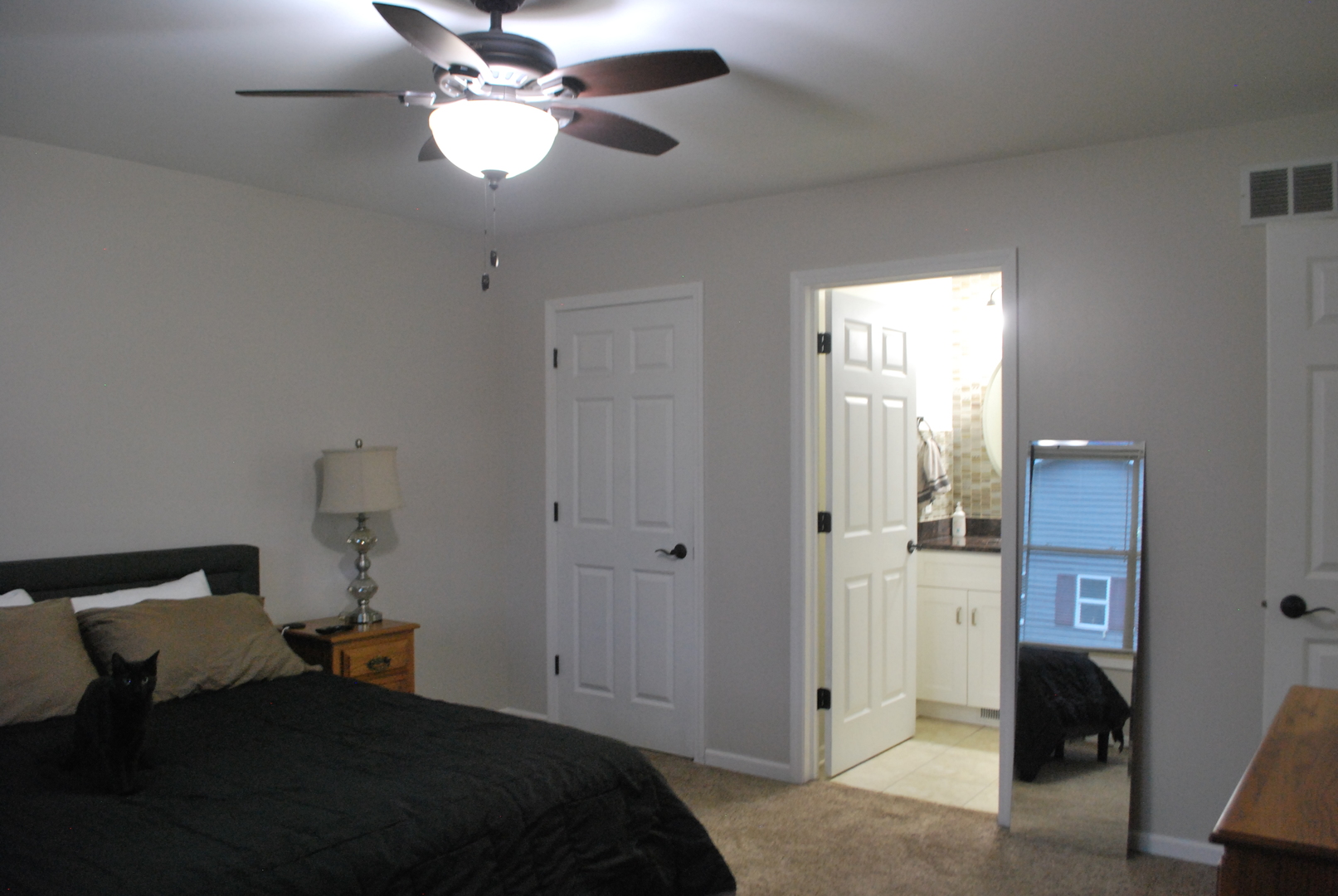 1091 Page Way Rochelle, IL 61068 - Photo 14 of 25 a bedroom with a bed and a chandelier