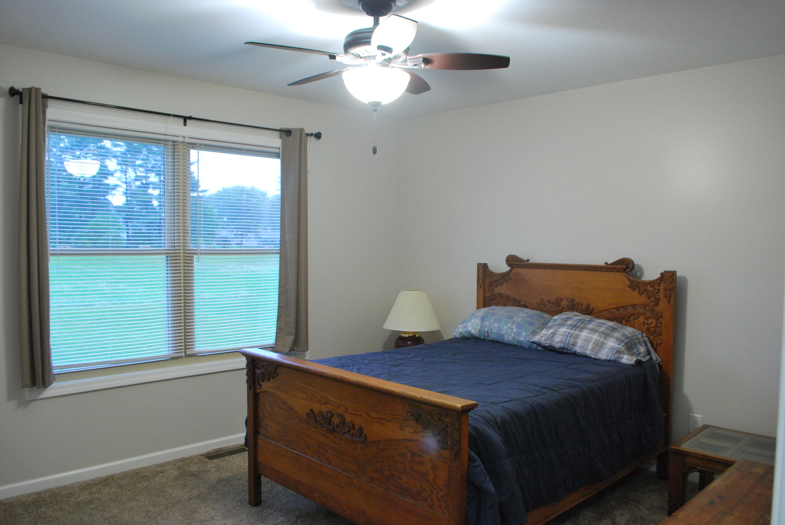 1091 Page Way Rochelle, IL 61068 - Photo 15 of 25 a bed sitting in a bedroom next to a window