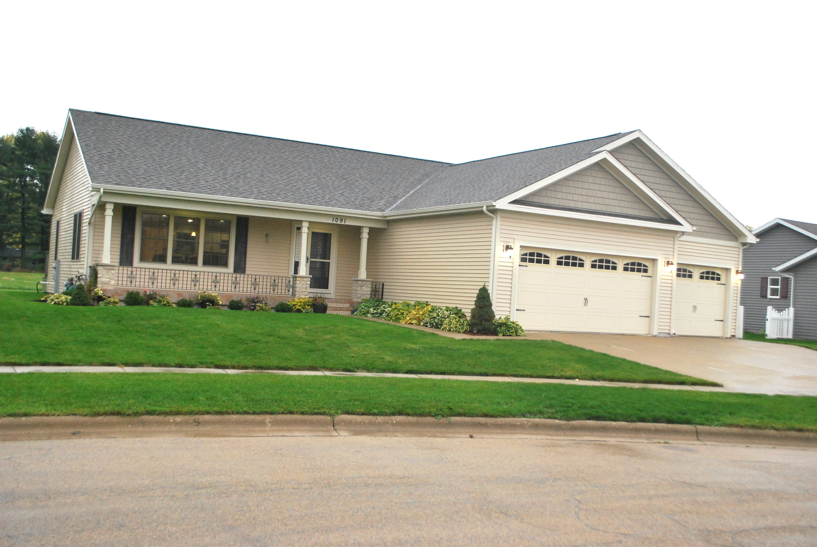 1091 Page Way Rochelle, IL 61068 - Photo 4 of 25 a front view of a house with a garden and yard