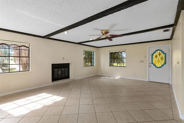 a view of an empty room with windows