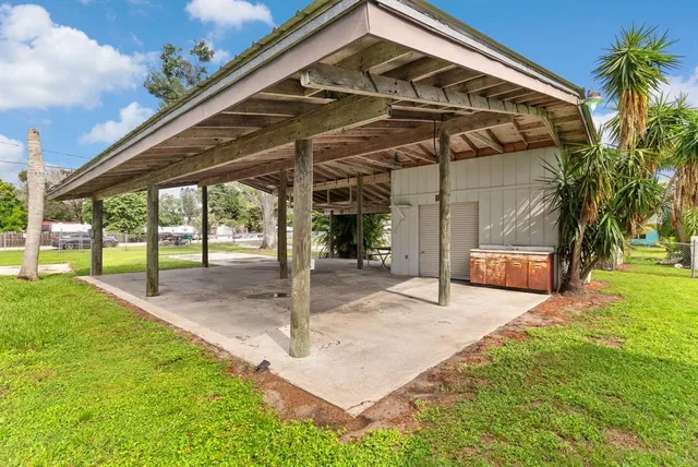 a view of a backyard with swimming pool