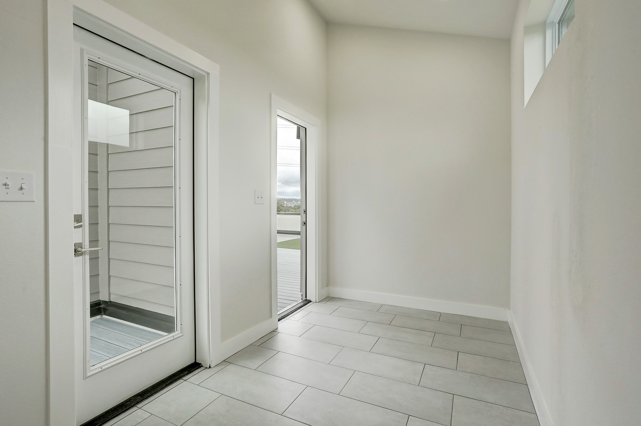 4300 Mansfield Dam Road, Unit 531 Austin, TX 78734 - Photo 23 of 32 Clean lines and durable tile flooring define this bright modern entry hall.
