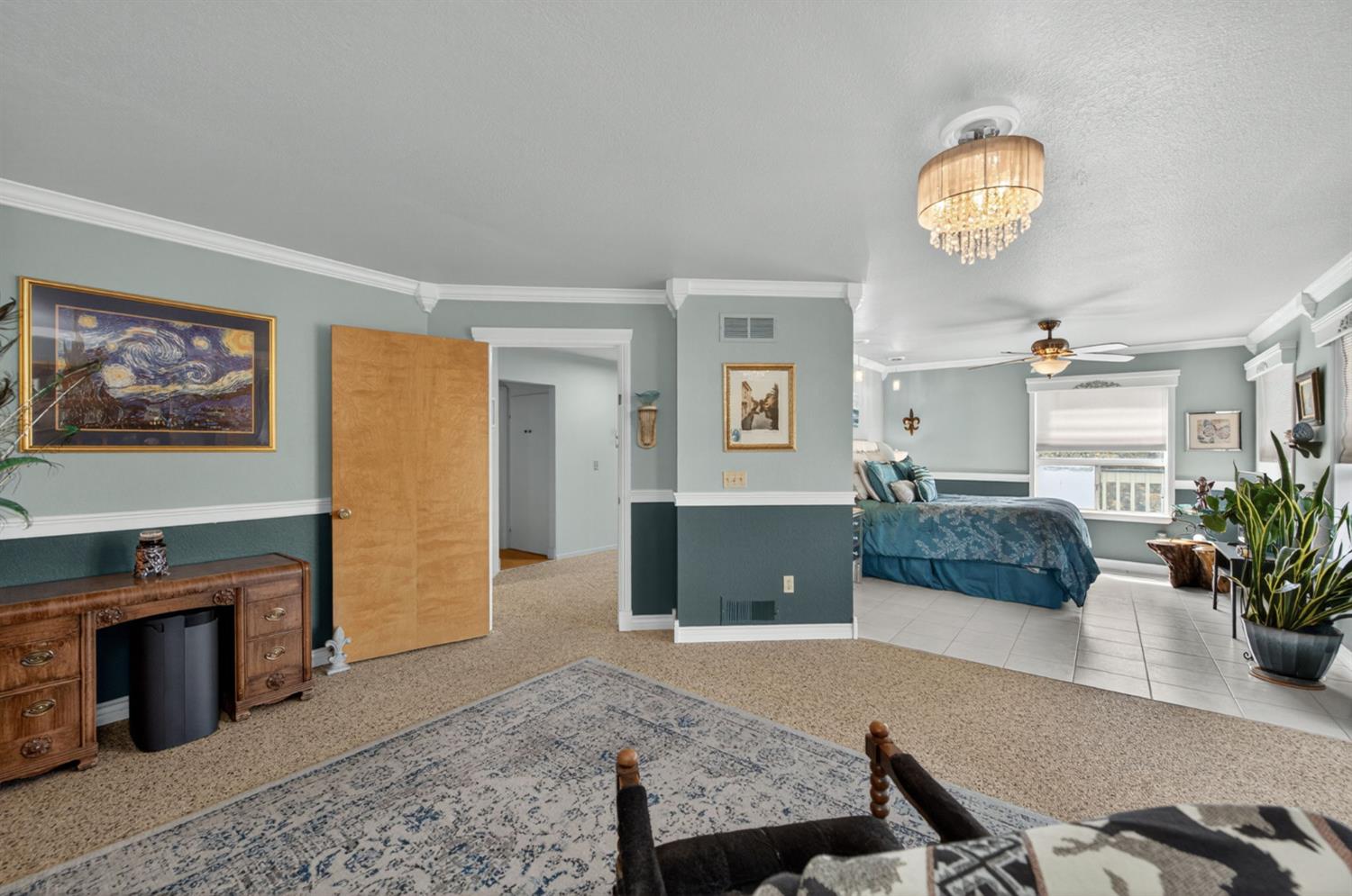 28037 Sky Harbour Road Friant, CA 93626 - Photo 14 of 40 a living room with furniture a dining table with wooden floor and a fireplace