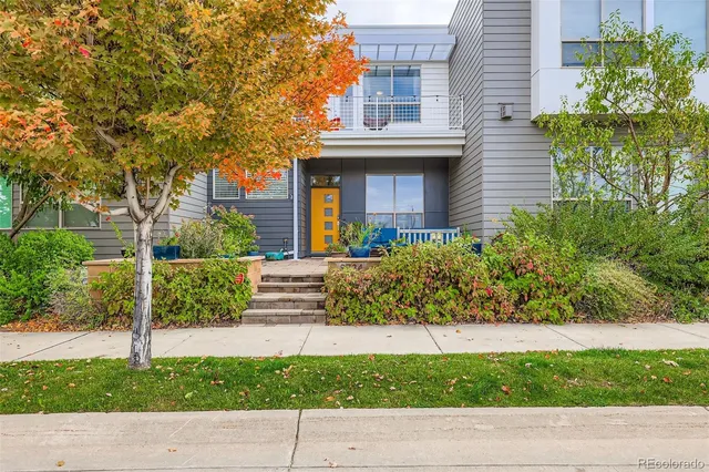a view of a bench in front of a house