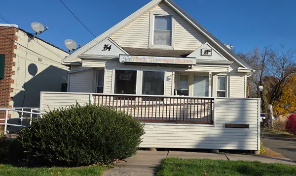 a view of a house with a yard