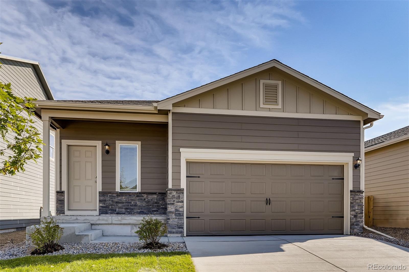 a front view of a house with garage