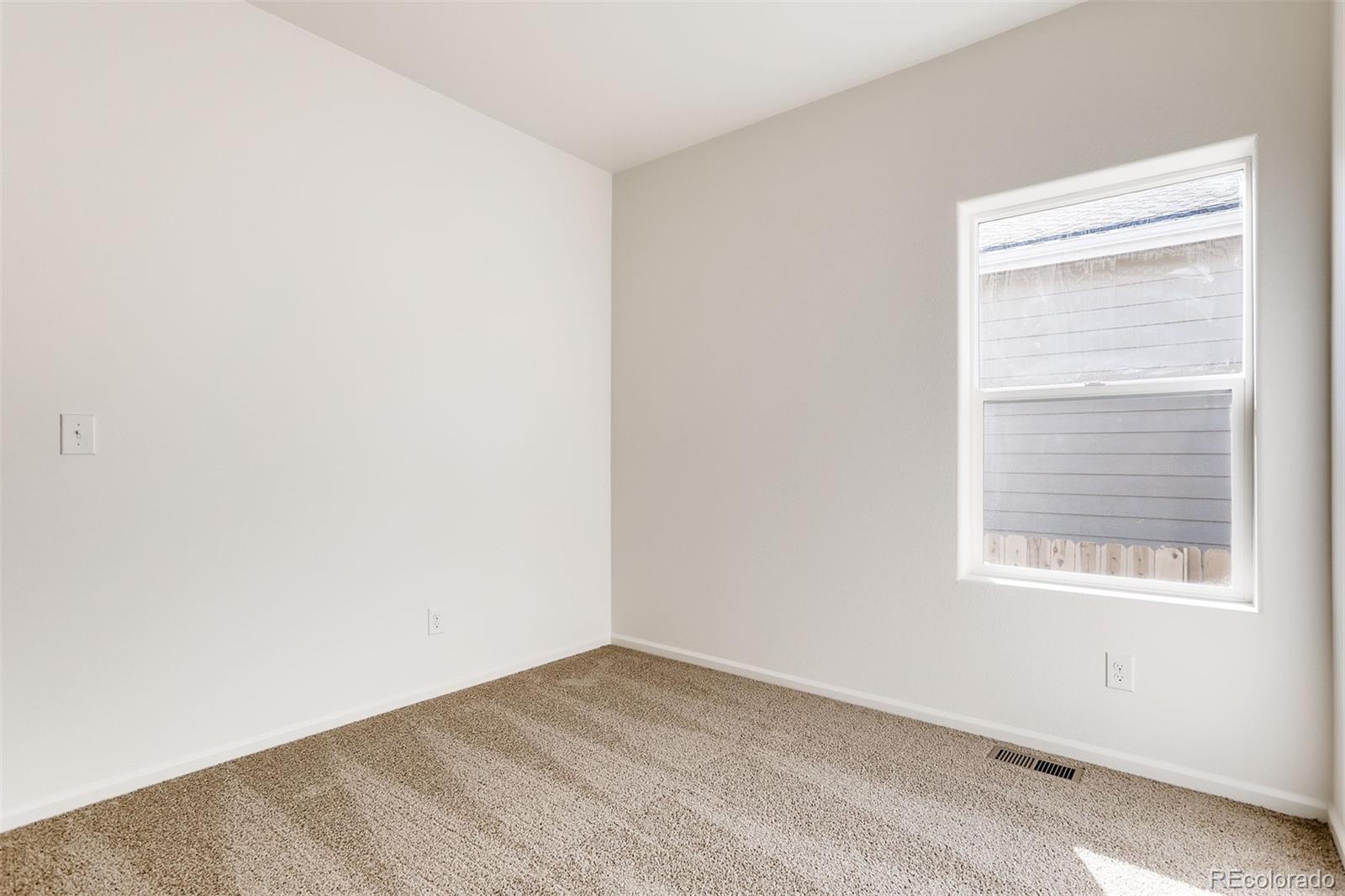 47517 Clover Avenue Bennett, CO 80102 - Photo 18 of 22 an empty room with a window