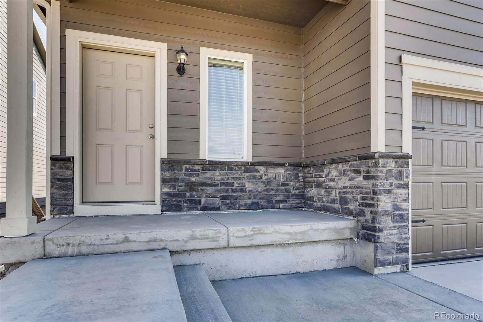 47517 Clover Avenue Bennett, CO 80102 - Photo 2 of 22 a view of a brick house