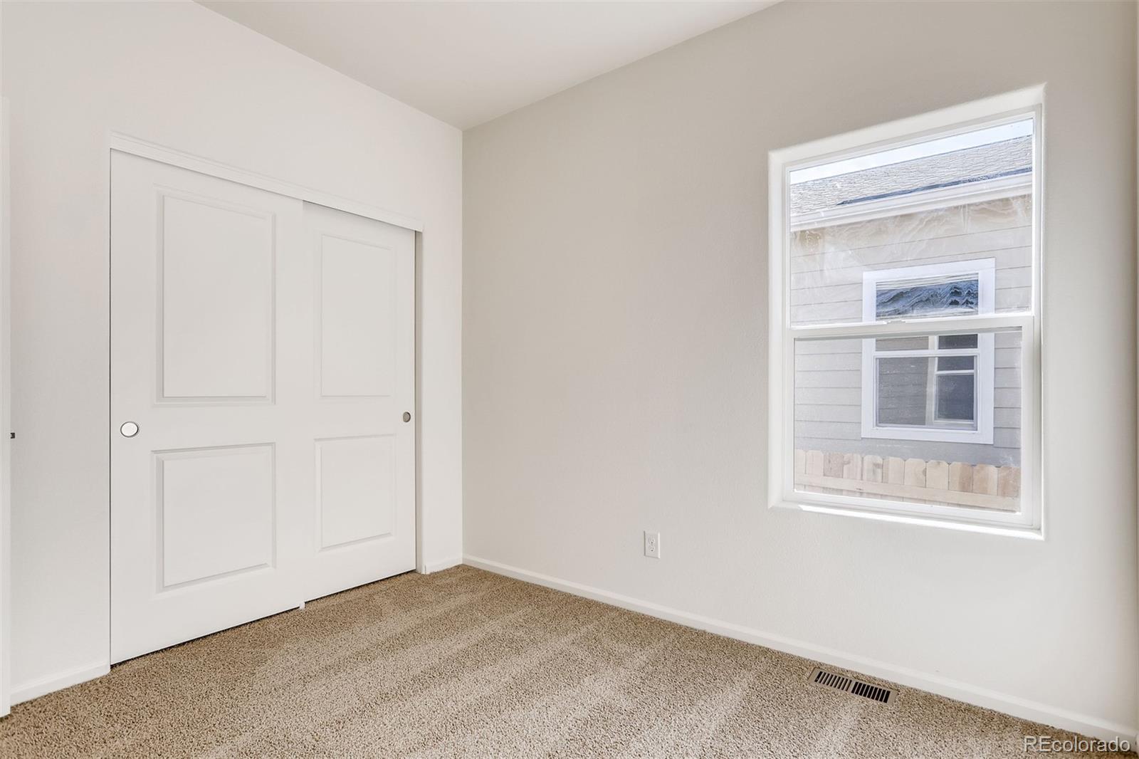 47517 Clover Avenue Bennett, CO 80102 - Photo 22 of 22 a view of an empty room with a window